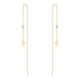 Elegante Tamaris Ohrhänger - Blume: Zarte goldene Ohrhänger mit funkelnden Zirkonia und einem zierlichen Dreifaltigkeitsknoten-Anhänger - stilvolle Accessoires von Tamaris.