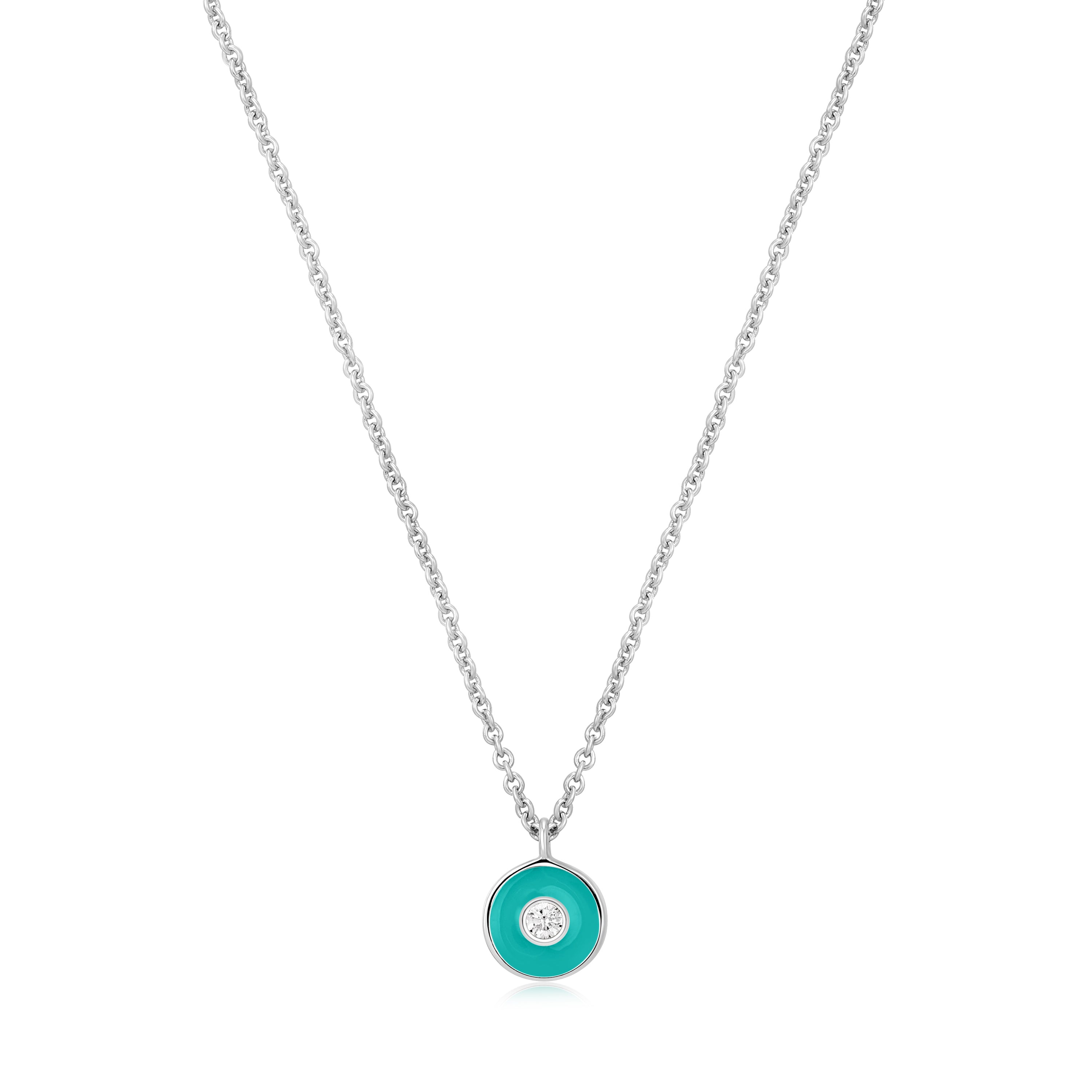 Die Ania Haie Halskette - The Turquoise Emaille Pendant aus 925er Sterlingsilber präsentiert einen runden Türkis-Anhänger, verziert mit einem zentralen Zirkonia.