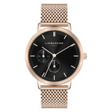 Liebeskind Berlin Armbanduhr mit schwarzem Zifferblatt, roségoldenem Gehäuse, geriffeltem Topring und roségoldenem Meshband Produktbild