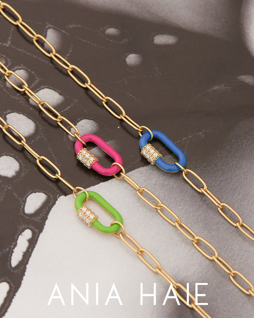 Ania Haie Armbänder aus goldenen Gliedern und verschieden lackierten Anhängern mit Glitzersteinen Produktbild