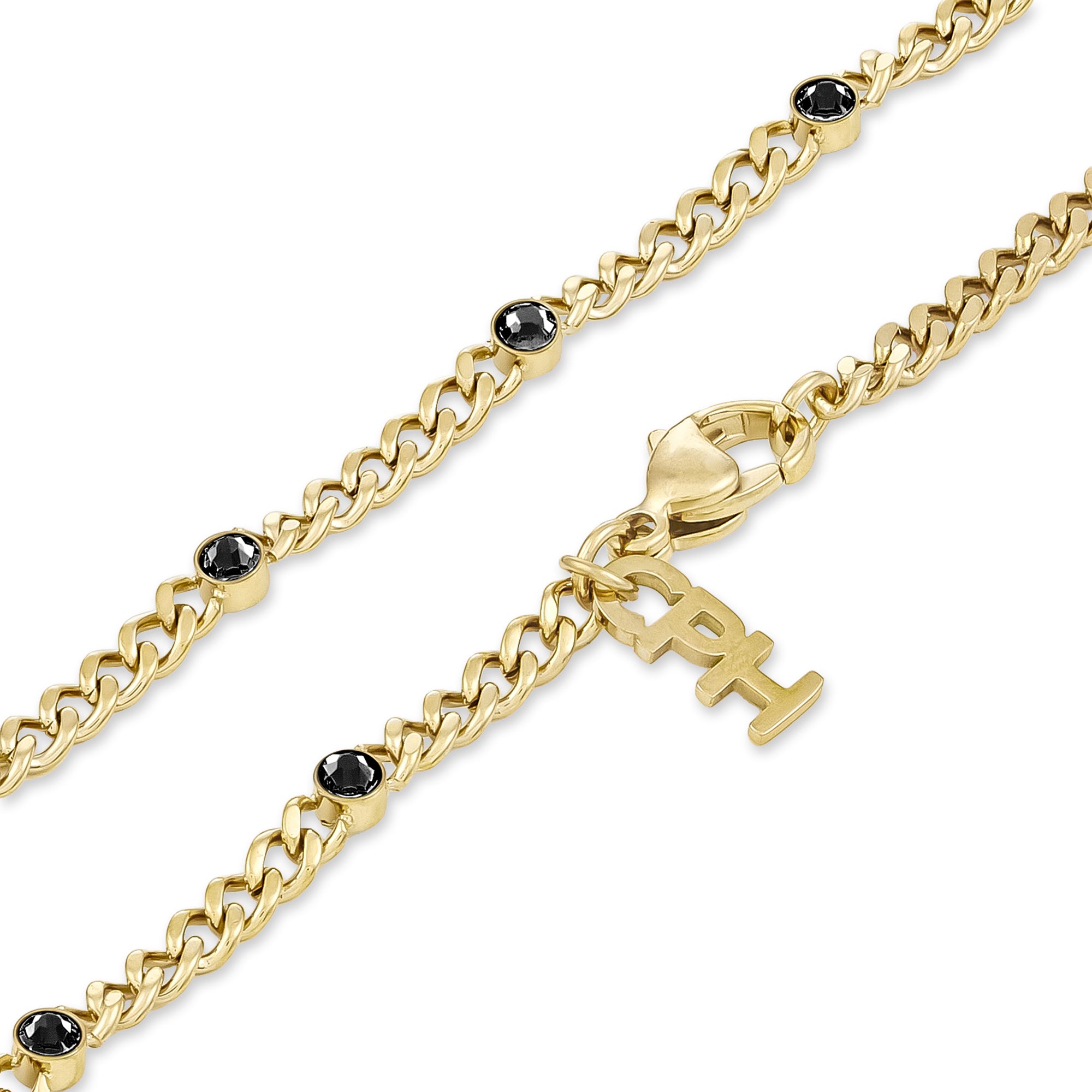 Das COPENHAGEN STUDIOS Armband - Glittery von Copenhagen Studios ist ein goldenes Kettenarmband, das mit schwarzen Edelsteinen und einem baumelnden "PH"-Anhänger verziert ist und mit der für die Marke typischen Eleganz gestaltet wurde.