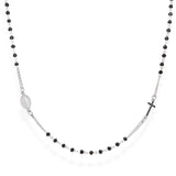 Die Amen Halskette - The Cross von Amen ist eine rosenkranzähnliche Unisex-Halskette aus 925er Sterlingsilber mit schwarzen Perlen, einem kleinen Kreuz und einem ovalen Medaillon - ideal, um Ihren Glauben mit Stil auszudrücken.