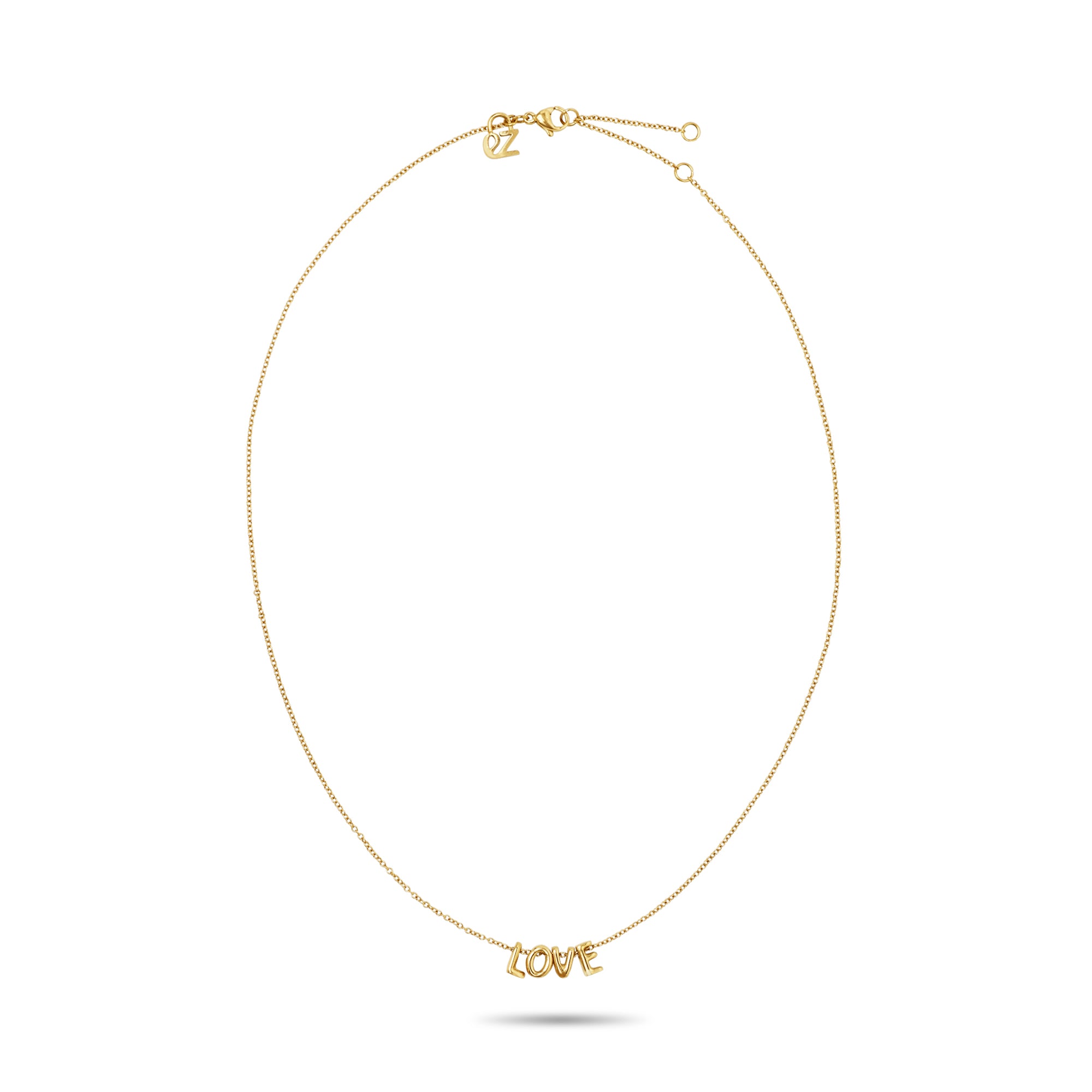 Die Echtzeit Halskette - Love Letters von Echtzeit ist eine elegante goldene Halskette mit zartem LOVE-Anhänger, stilvoll präsentiert auf weißem Hintergrund.