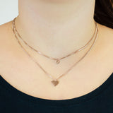 Die LIEBESKIND BERLIN Halskette - Layered Love von Liebeskind Berlin besteht aus zwei filigranen goldenen Edelstahlketten mit Kreis- und Herzanhänger, die den Hals stilvoll schmücken.