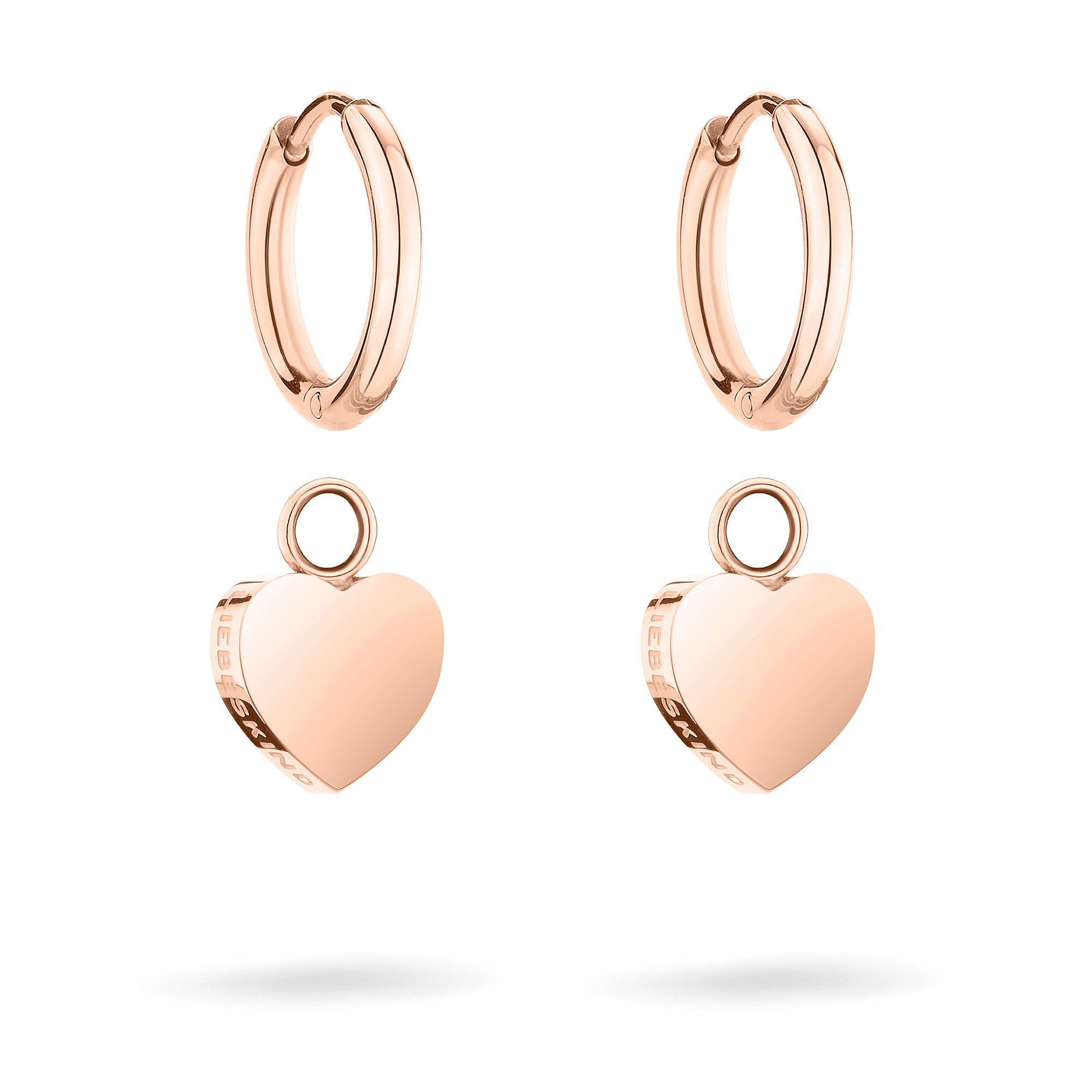 Der Liebeskind Berlin Ohrring - My Heart besticht durch sein elegantes Design in Roségold mit einem Herzanhänger, der auf weißem Hintergrund wunderschön präsentiert wird.