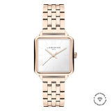 Die LIEBESKIND BERLIN Armbanduhr - The Classic Square besticht mit quadratischem Gehäuse, roségoldenem Metallarmband und Liebeskind Berlin Logo auf dem weißen Zifferblatt - ein Klassiker skandinavischen Designs.