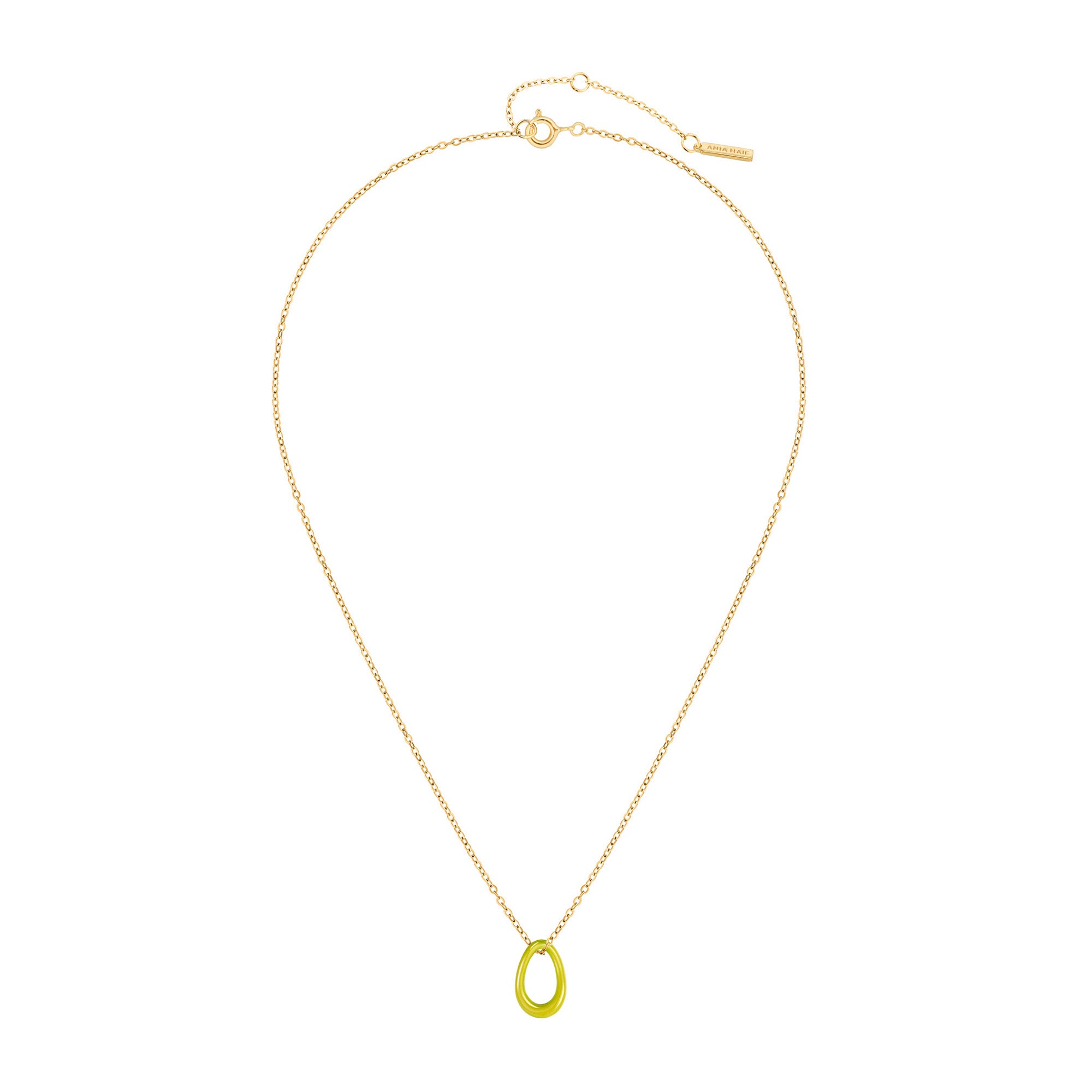 Die Ania Haie Halskette "Neon Yellow Twisted Pendant" zeigt eine goldene Gliederkette mit kleinem, oval gedrehten Neon-Gelb-Anhänger der Marke Ania Haie auf weißem Hintergrund.