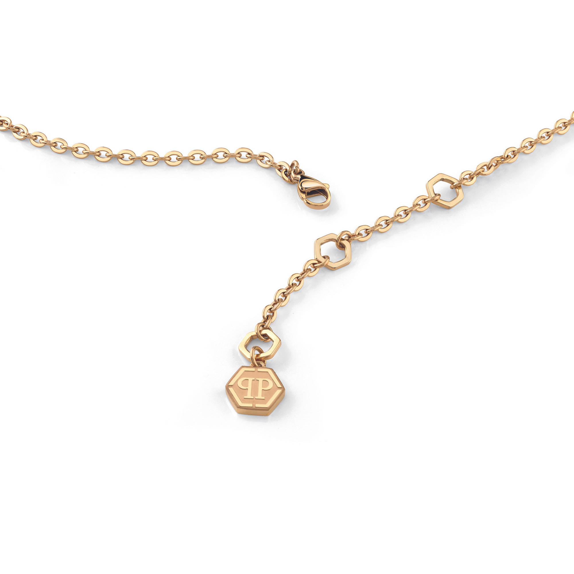 Die Philipp Plein Halskette - ROCKED HEARTS ist eine goldene Kette mit einem sechseckigen Monogramm-Anhänger und Karabinerverschluss, inspiriert von Philipp Pleins kühnem Stil.