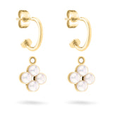 Die Tamaris Creole - The Flower Pearl von Tamaris präsentiert abnehmbare Blüten-Anhänger aus vier schimmernden Glasperlen im floralen Design, stilvoll vor weißem Hintergrund arrangiert.