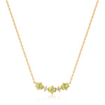 Ania Haie Halskette bestehend aus einer feinen goldenen Kette mit drei grünen Peridot-Steinen und zwei weißen Saphiren; Produktbild