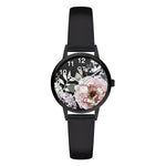 Cool Time Kids Armbanduhr mit Blütenmotiv auf dem Zifferblatt, schwarzem Gehäuse und schwarzem Kunstlederarmband; Produktbild