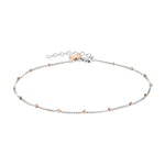 Die LIEBESKIND BERLIN Fußkette - The Simple Solo von Liebeskind Berlin ist aus Edelstahl mit dezenten roségoldenen Perlenakzenten und einem verstellbaren Verschluss gefertigt.