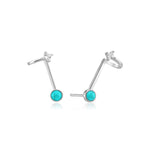 Ania Haie Ohrstecker - Turquoise Hidden Gem von Ania Haie: 925er Sterlingsilber Ohrringe mit Türkisstein-Anhängern und klaren Kristall-Studs, arrangiert auf weißem Hintergrund.