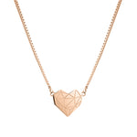 Liebeskind Berlin Halskette bestehend aus einer roségoldenen Venezianerkette und einem geometrischen Herzanhänger mit grafischen Elementen; Produktbild