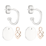 Das LIEBESKIND BERLIN Creole - Keep Loving von Liebeskind Berlin ist ein Paar Silberohrringe mit zwei Sets austauschbarer Anhänger: runde Scheiben und roségoldene Designs.