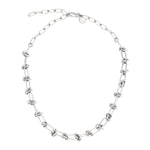 The LIEBESKIND BERLIN Halskette – The Knot is a silver stainless steel necklace with evenly spaced knot details and an adjustable clasp, shown on a white background.