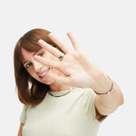 Tamaris Ring - Time To Smile; in der Farbe silber mit verschiedenen eingravierten Glückssymbolen und einem Zirkonia; Größe 54 Tragebild