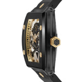 Philipp Plein Armbanduhr im Tonneau Shape mit teilskelettiertem silbernem Zifferblatt mit schwarzem glassteinbesetztem Totenkopf- und Knochenmotiv und goldenen Akzenten, schwarzem Gehäuse mit goldenen Akzenten und schwarzem Edelstahlband Seitenansicht