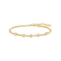 Das ANIA HAIE Armband - Round Stone von Ania Haie besteht aus einer goldenen Kette mit gleichmäßig verteilten runden, klaren Edelsteinen und einem verstellbaren Verschluss.