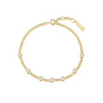 Das ANIA HAIE Armband - Round Stone von Ania Haie besteht aus einer goldenen Kette mit gleichmäßig verteilten runden weißen Steinen und einem kleinen rechteckigen Anhänger an der Schließe.