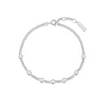 Draufsicht des ANIA HAIE Round Stone Armbands aus Sterling Silber – kreisförmig gelegte Kette mit regelmäßig platzierten Zirkonia-Solitären und Markenanhänger.