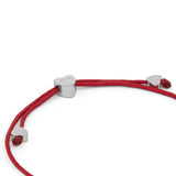 COPENHAGEN STUDIOS Armband - Ballonherzen: Ein rotes Kordelarmband mit drei silbernen, herzförmigen Perlen von Copenhagen Studios, abgebildet auf weißem Hintergrund.