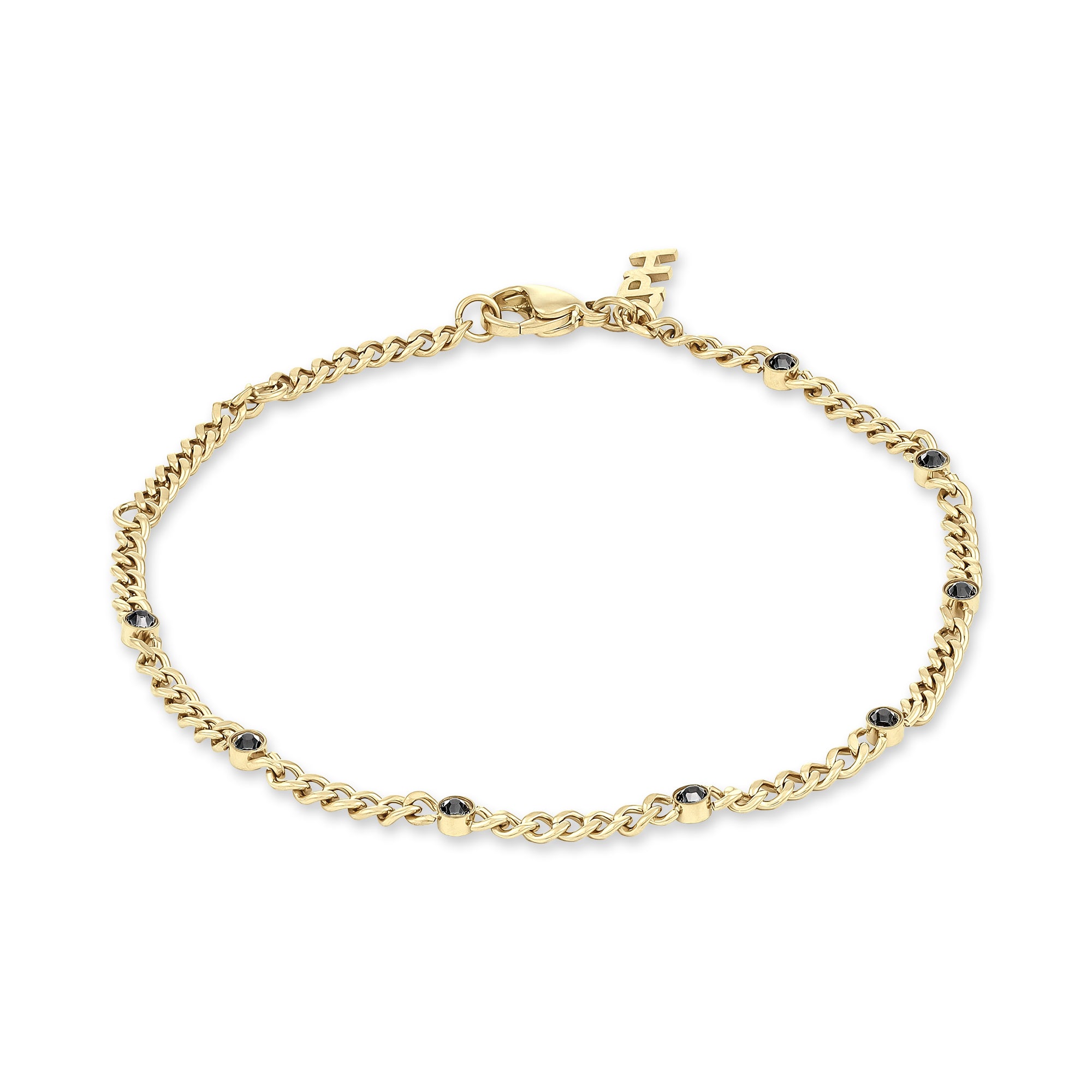 Das COPENHAGEN STUDIOS Armband - Glittery von Copenhagen Studios hat eine goldene Kette mit gleichmäßig verteilten kleinen schwarzen Steinen und einen sicheren Karabinerverschluss.