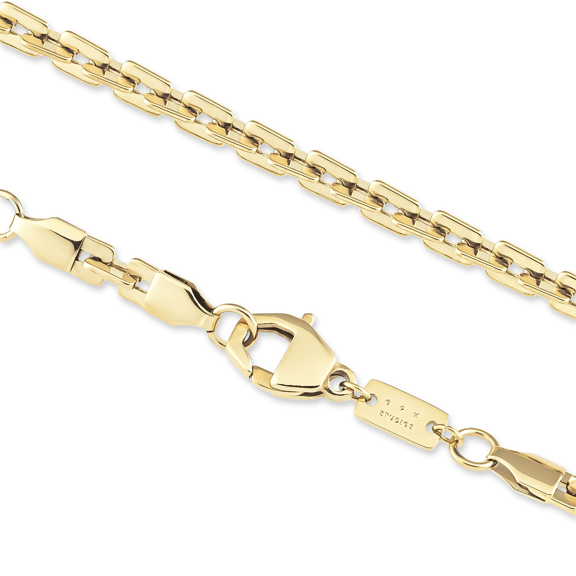 Nahaufnahme der COPENHAGEN STUDIOS Halskette - Edgy Necklace von Copenhagen Studios. Die goldene Kette mit Karabinerverschluss auf weißem Grund unterstreicht das moderne und urbane Design.