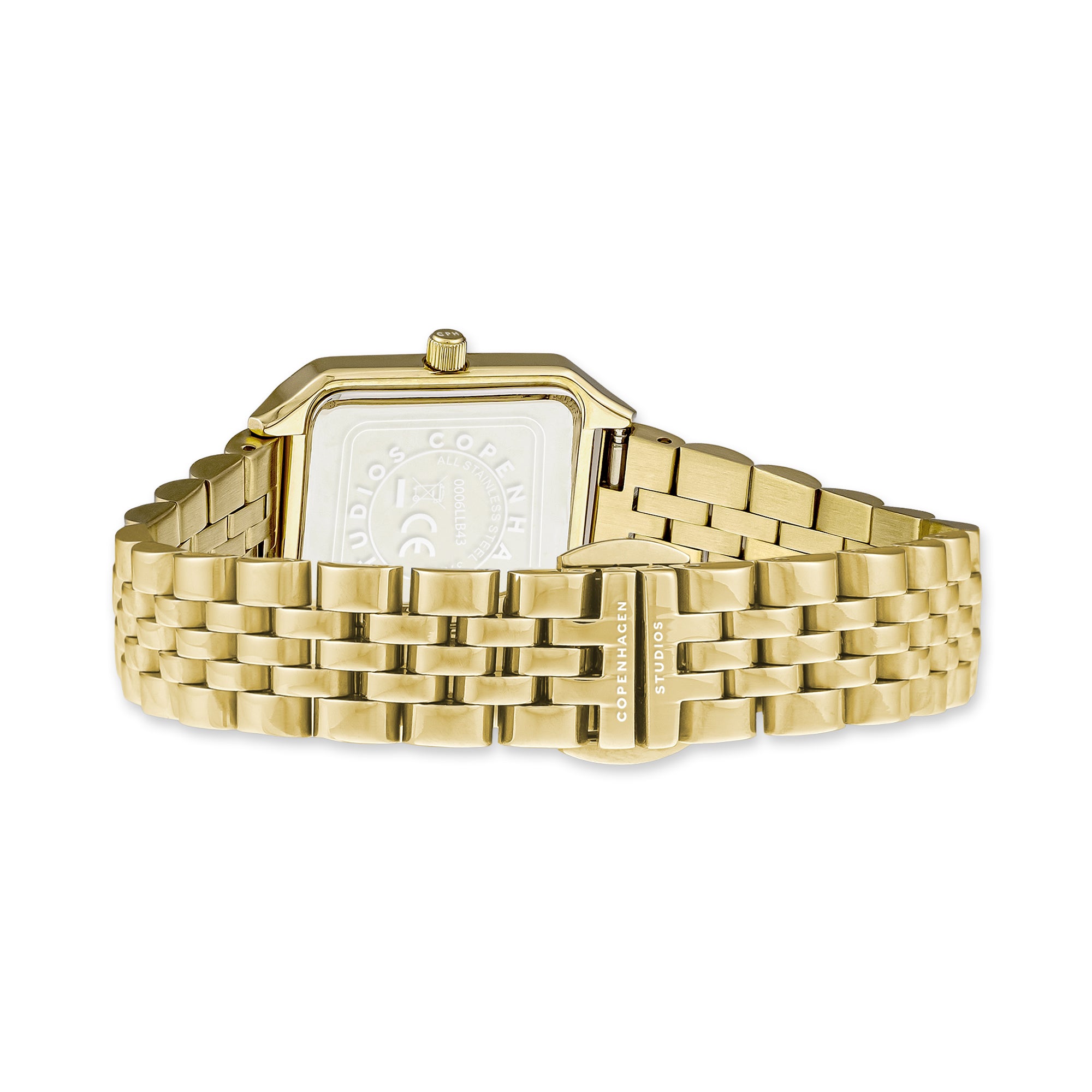 Die COPENHAGEN STUDIOS Armbanduhr von Copenhagen Studios hat ein goldenes, rechteckiges Zifferblatt, ein Gliederarmband aus Metall und eine Schließe, die den zeitlosen Charme einer Vintage-Uhr einfängt.