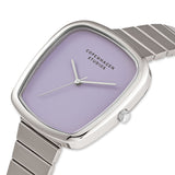 COPENHAGEN STUDIOS Armbanduhr - Curved Watch von Copenhagen Studios: Eine silberne Damenuhr mit lavendelfarbenem Zifferblatt und minimalistischem Design, ideal für einen zeitgenössischen Stil.