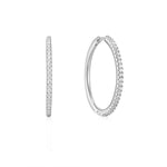 Die Ania Haie Ohrringe - Glam Hoop sind elegante silberne Creolen mit kleinen, funkelnden Zirkonia-Steinen entlang des Randes in Front- und Seitenansicht.
