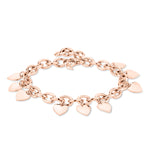 Das Echtzeit Armband - Endless Love von Echtzeit ist ein roségoldenes Armband, das mit mehreren kleinen Herzanhängern verziert ist.