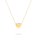 Zeitloses Accessoire: Die Echtzeit Halskette - Puffy Heart von Echtzeit aus Gold mit schlichtem Herzanhänger an feiner Kette, präsentiert auf weißem Hintergrund.