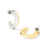 Zwei LIEBESKIND BERLIN Creole - The Basic Bicolor Creolen von Liebeskind Berlin, eine silberne und eine goldene, sind auf einem weißen Hintergrund abgebildet.