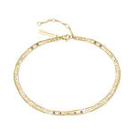 Die LIEBESKIND BERLIN Fußkette - Sparkling With Layers von Liebeskind Berlin zeichnet sich durch zarte Goldschichten, einen verstellbaren Verschluss und ein Markenetikett aus - ein zeitloses Accessoire für jede Kollektion.
