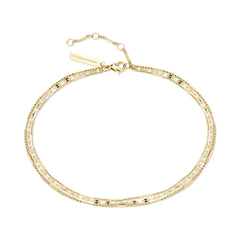 Die LIEBESKIND BERLIN Fußkette - Sparkling With Layers von Liebeskind Berlin zeichnet sich durch zarte Goldschichten, einen verstellbaren Verschluss und ein Markenetikett aus - ein zeitloses Accessoire für jede Kollektion.