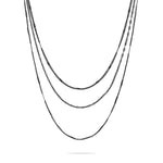 Die LIEBESKIND BERLIN Halskette "Sparkling With Layers" von Liebeskind Berlin wird als stilvolles, mehrgliedriges Schmuckstück auf weißem Hintergrund präsentiert.