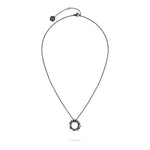 Die LIEBESKIND BERLIN Halskette - 3D Lettering von Liebeskind Berlin besteht aus einer dünnen Kette und einem runden Anhänger mit kantigen Zacken, der auf Weiß abgebildet ist - ein außergewöhnliches Stück für jede Schmucksammlung.