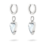 LIEBESKIND BERLIN Creole - Glass Heart von Liebeskind Berlin, bestehend aus silbernen Ohrringen mit klaren, herzförmigen Anhängern auf weißem Hintergrund.