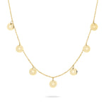 Die Liebeskind Berlin Halskette - Vintage Coins präsentiert sieben kleine, runde Münzen-Anhänger, die gleichmäßig an einer feinen Kette der Marke Liebeskind Berlin angeordnet sind.