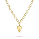 Die LIEBESKIND BERLIN Halskette - Metal Heart von Liebeskind Berlin ist eine goldene Kette mit einem glänzenden Herzanhänger auf weißem Grund - ein zeitloser Damen Schmuck.