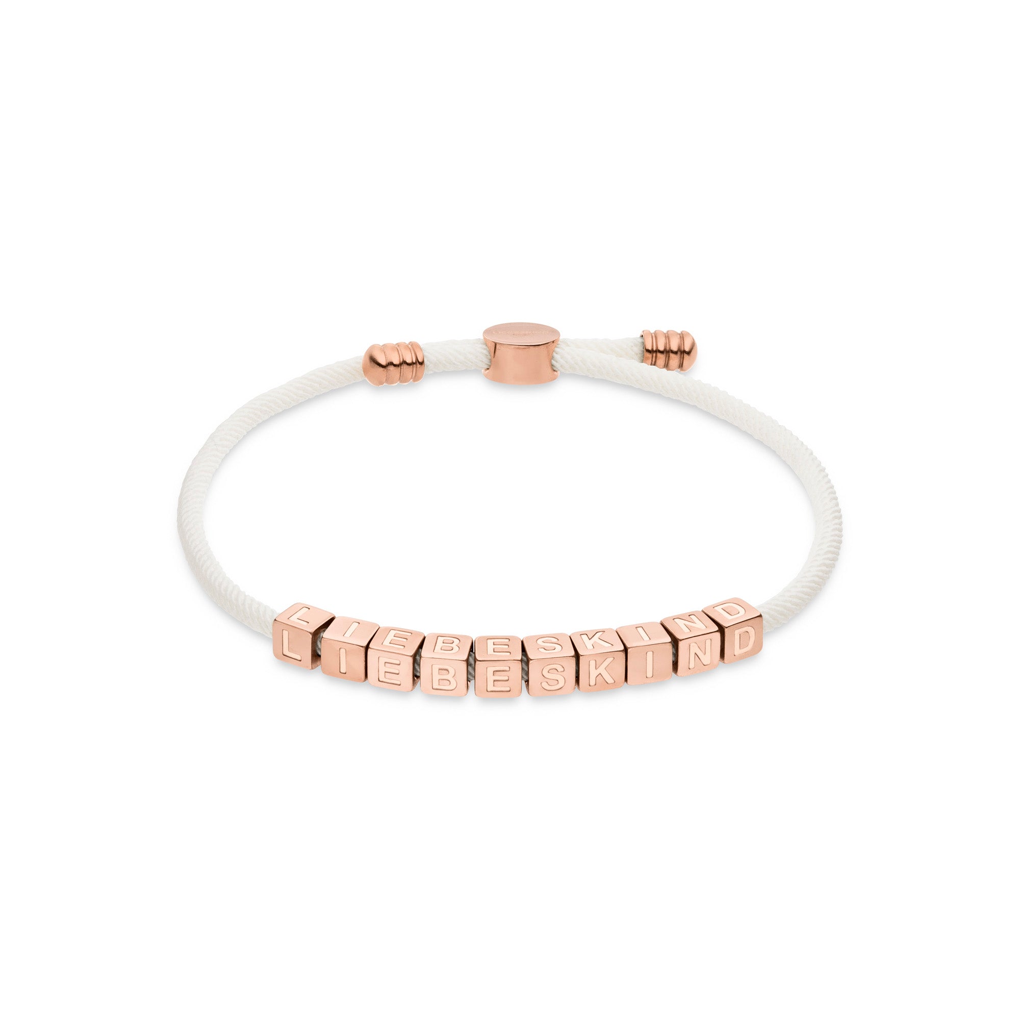 Das LIEBESKIND BERLIN Armband - Brick von Liebeskind Berlin hat ein weißes Textilband, roségoldene Buchstabenperlen mit dem Schriftzug LIEBESKIND und eine passende Schließe - ein auffälliges Statement.