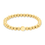 Das Armband LIEBESKIND BERLIN Beads - Steel Beads von Liebeskind Berlin ist mit goldenen Perlen und einem runden Markenanhänger in der Mitte versehen.