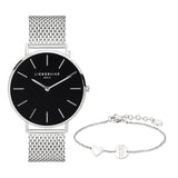 Das Liebeskind Berlin Set - Lovely Silver Basic kombiniert eine silberne Uhr mit schwarzem Zifferblatt und ein feines Armband mit Herzanhänger - das ideale Accessoire für elegante Damen.