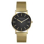 Liebeskind Berlin Armbanduhr mit schwarzem Zifferblatt, goldenen Indizes, goldenem Gehäuse und goldenem Meshband; Produktbild