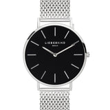 Silberne Uhr Damen: Das LIEBESKIND BERLIN Set - Lovely Silver Basic überzeugt mit silbernem Mesh-Armband, schwarzem Zifferblatt und weißen Stundenmarkern - ein elegantes Accessoire für jeden Anlass.