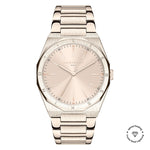 Die LIEBESKIND BERLIN Armbanduhr - The Classic Must-Have ist eine roségoldene Edelstahluhr mit rundem Zifferblatt, minimalistischen Stundenindizes, dem Liebeskind Berlin Logo und einem Freundschaftssymbol mit Text in der unteren rechten Ecke.