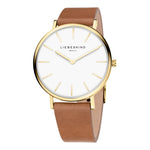 Die LIEBESKIND BERLIN Armbanduhr - The Modern Must-Have für Damen besticht durch ein goldenes Gehäuse, weißes Zifferblatt und braunes Echtlederarmband von Liebeskind Berlin; sie zeigt 10:09 Uhr an.