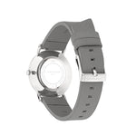 Die LIEBESKIND BERLIN Armbanduhr - The Leather One besticht durch ein graues Lederarmband, eine silberne Schließe sowie Gehäuse und Markenlogo von Liebeskind Berlin auf der Rückseite.