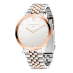 Die LIEBESKIND BERLIN Armbanduhr - The Classy zeichnet sich durch ein silbernes und roségoldenes Design, ein schlichtes rundes Zifferblatt, ein Quarzwerk, ein Edelstahlgehäuse und das Liebeskind Berlin Branding auf dem Zifferblatt aus.